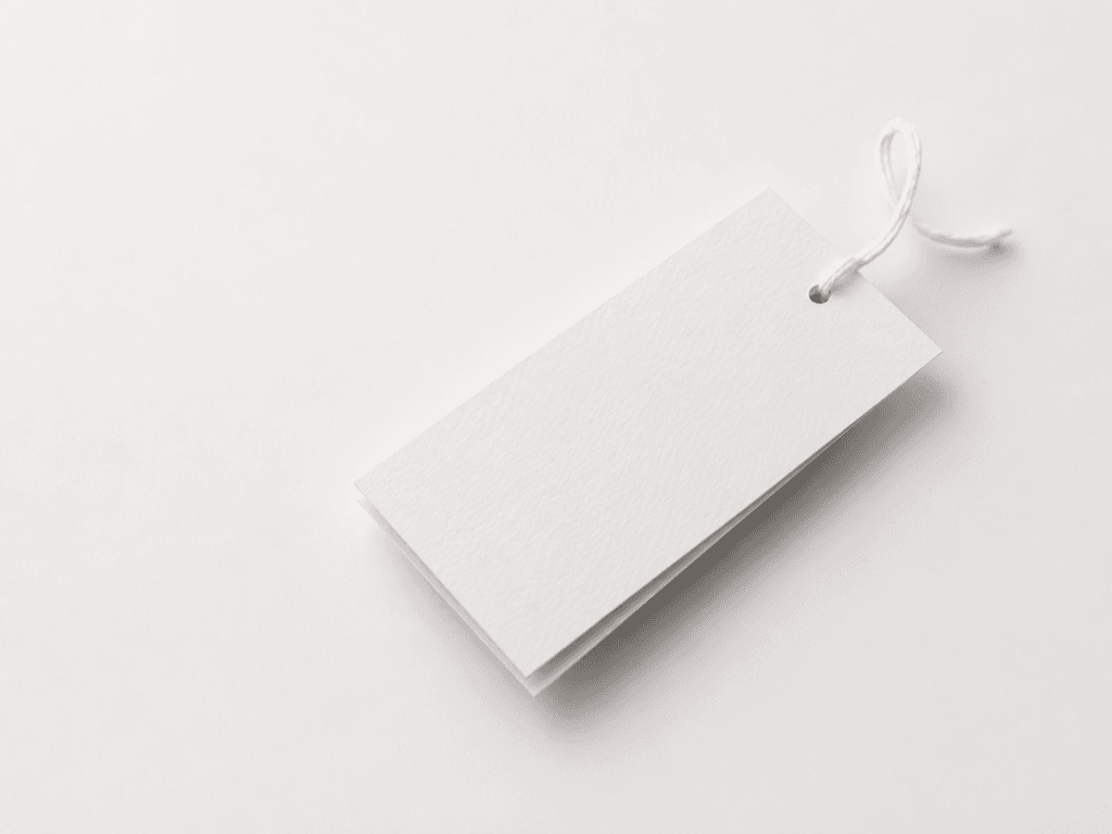 Blank white label attached to a loop of string