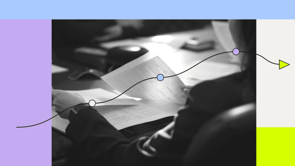 Colleagues reviewing a report with an overlaid route and milestones