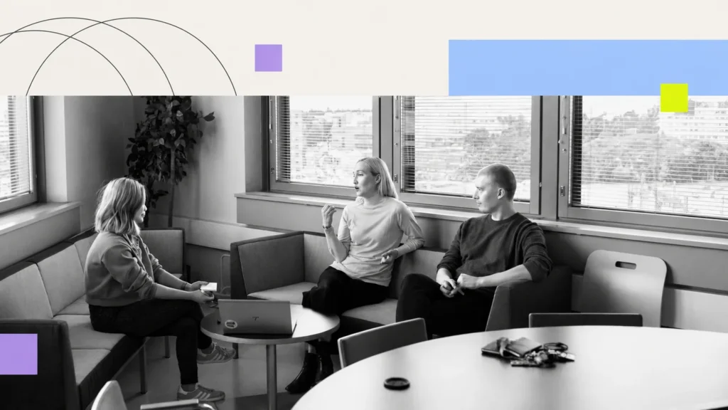 Three people engaged in a discussion.