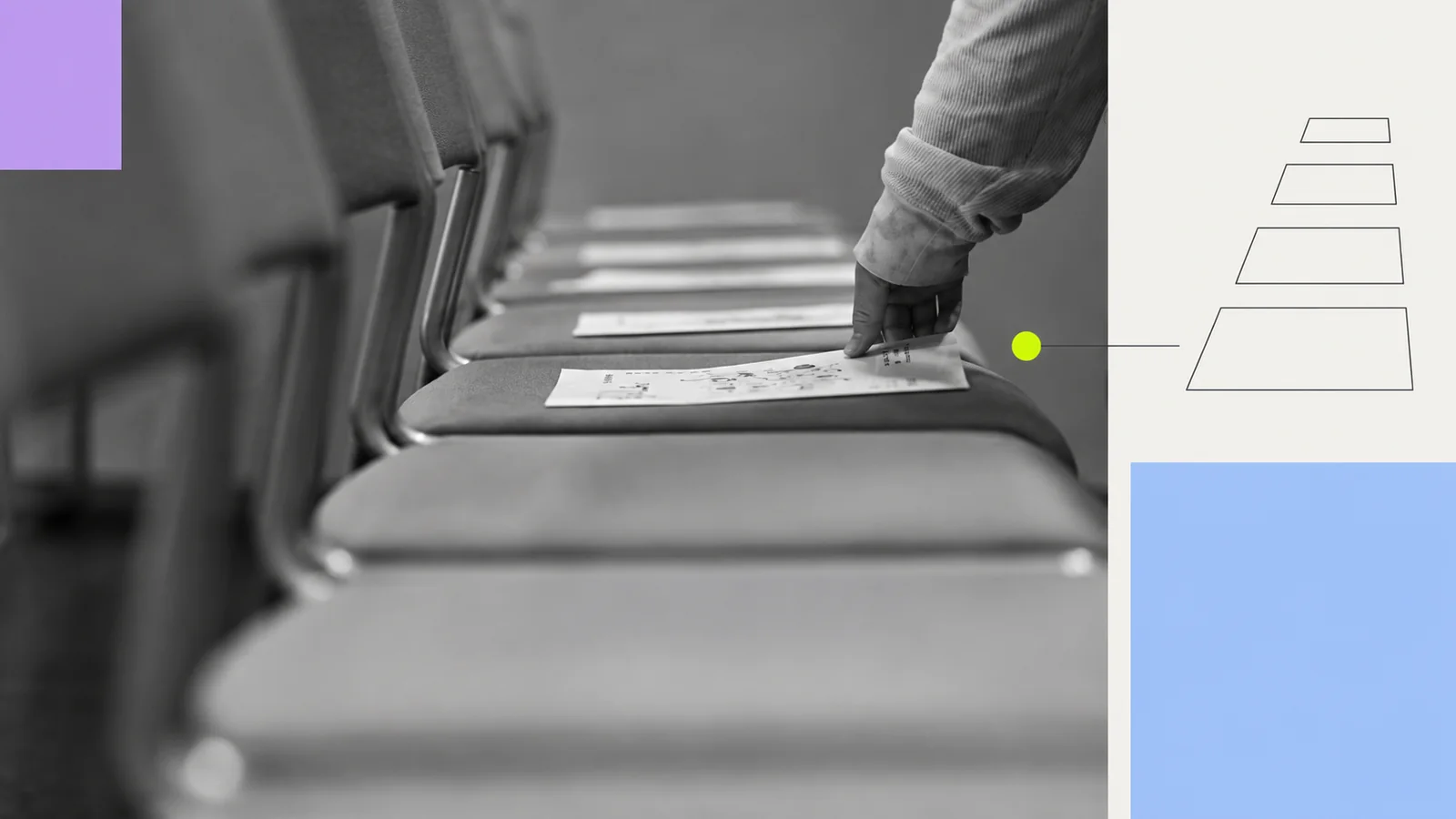 A hand placing leaflets on a row of chairs.
