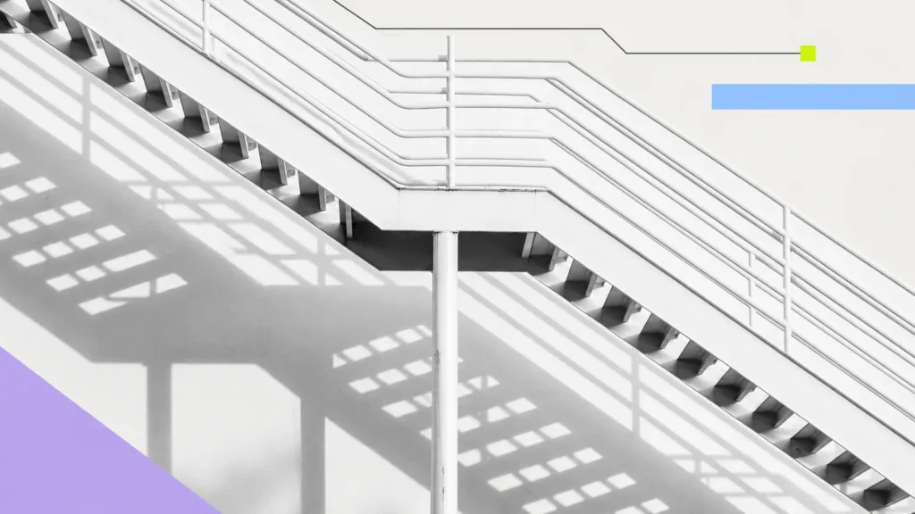 A staircase crossed by strong architectural shadows.